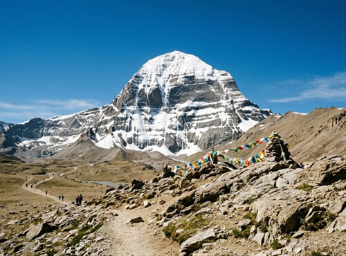 Lake Manasarovar at sunrise during private Mount Kailash Yatra — sacred bathing rituals